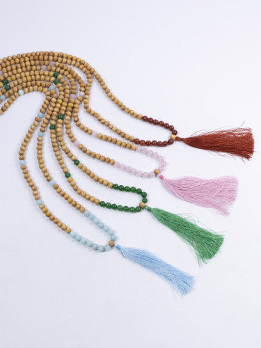 Mala madera con mineral y fleco