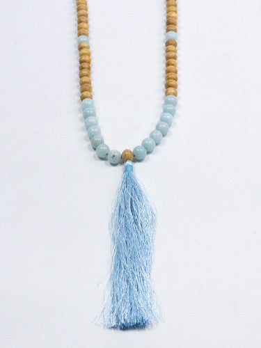 Mala madera con mineral y fleco